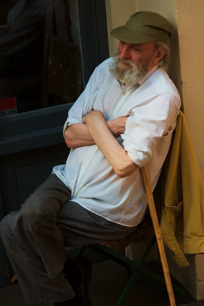 An older man resting, representing members who work around limited mobility